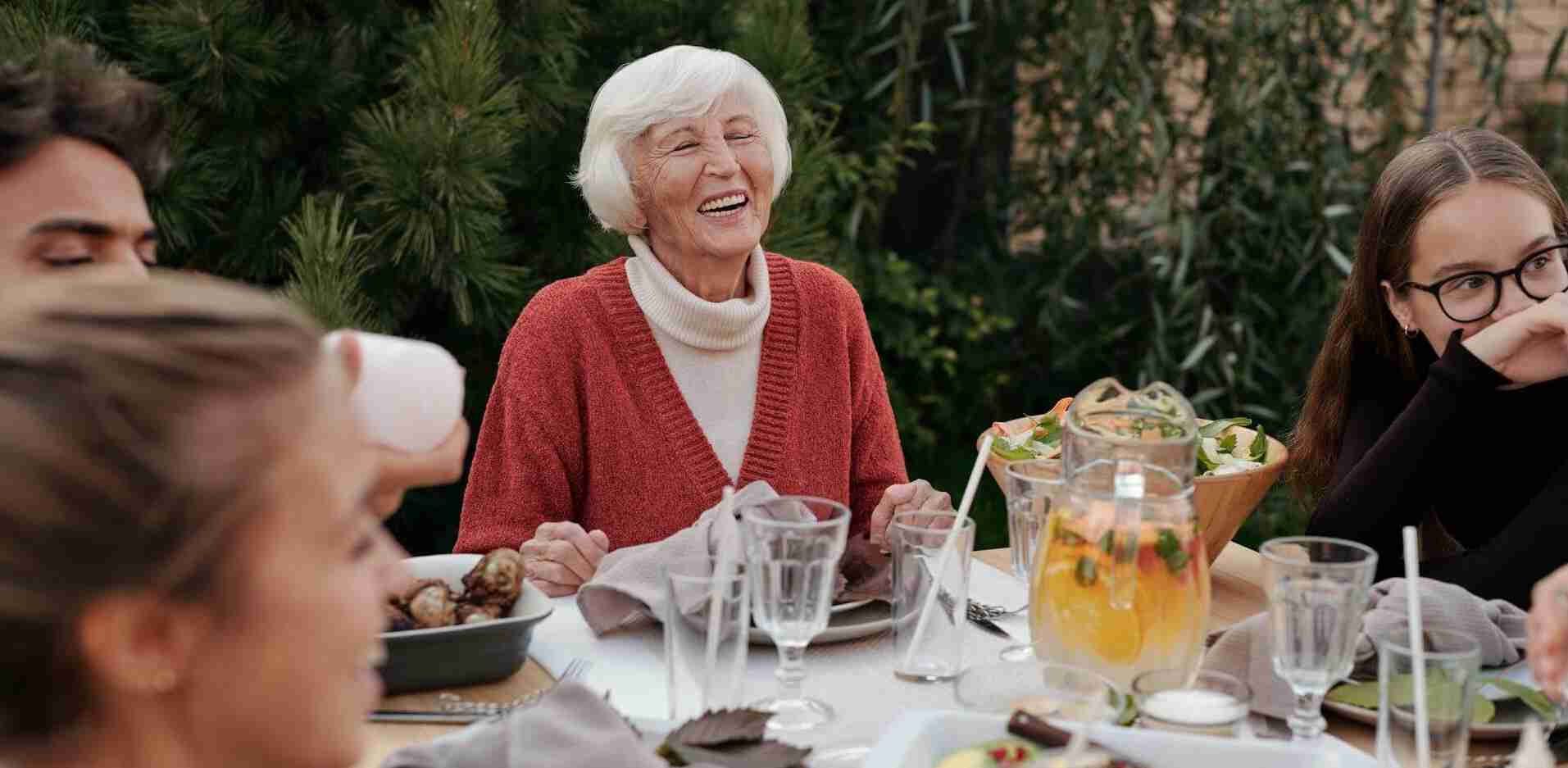 family gathered around a table, enjoying a meal