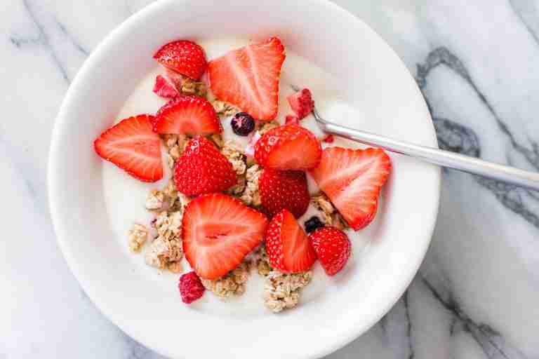 bowl of cereal with strawberries